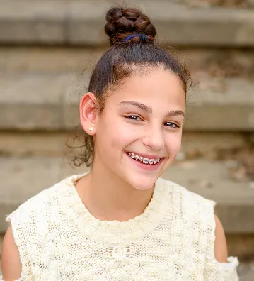 Patient with braces smiling